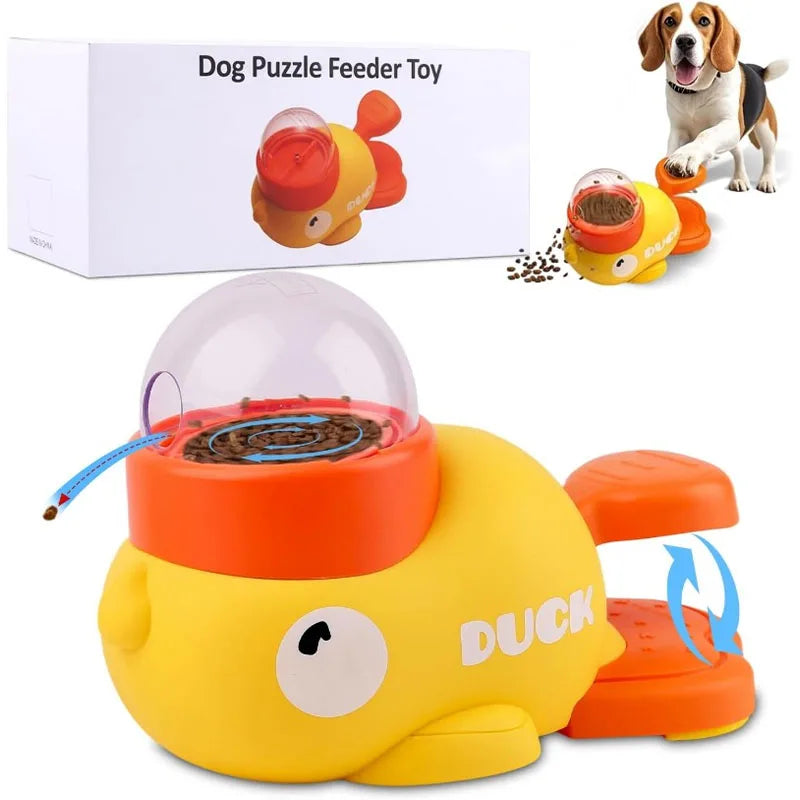 Dog puzzle feeder toy shaped like a duck with packaging and a dog in the background.

