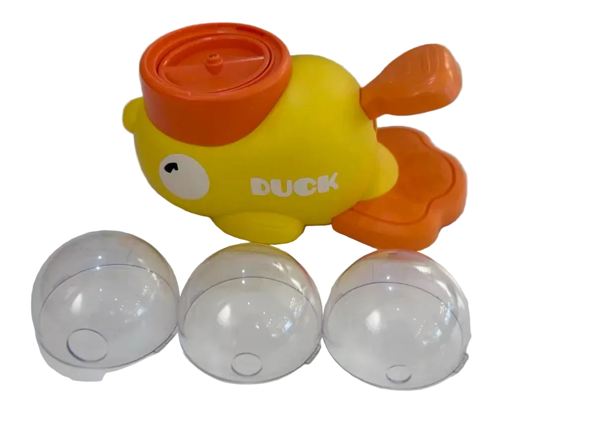 Yellow duck toy with orange accents and three clear plastic balls on a white background