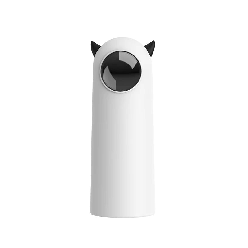 White cylindrical object with black circular feature and small black horns on a white background

